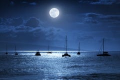 Dramatic Nighttime Ocean Scene With Beautiful Full Blue Moon in Lahaina on the island of Maui, Hawaii