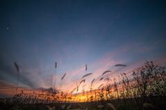 Dramatic Partially Cloudy Crimson Sunset Sky with Moon Crescent royalty free stock images Dramatic Partially Cloudy Crimson Sunset Sky with Moon Crescent royalty free stock images
