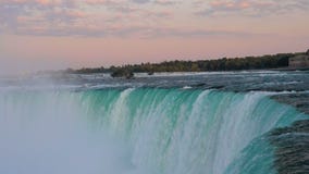 Dramatic sunset at horse shoe falls in Niagara Falls, Ontario, Canada.