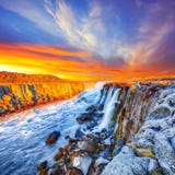 Dramatic sunset view of fantastic waterfall and cascades of Selfoss waterfall