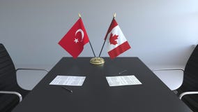 Drapeaux de la Turquie et du Canada et papiers sur la table Négociations et signature d'un accord international 3D conceptuel illustration stock Drapeaux de la Turquie et du Canada et papiers sur la table Négociations et signature d'un accord international 3D conceptuel illustration stock