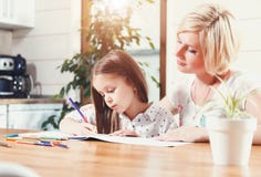 Mother And Daughter Drawing Toogether royalty free stock images Mother And Daughter Drawing Toogether royalty free stock images