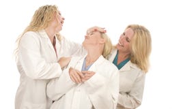 Drei medizinische Frauen der Krankenschwestern mit glücklichem Ausdruck lizenzfreie stockfotos Drei medizinische Frauen der Krankenschwestern mit glücklichem Ausdruck lizenzfreie stockfotos