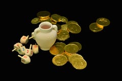 Dreidel (spinning top), gelts (candy coins) stock images Dreidel (spinning top), gelts (candy coins) stock images