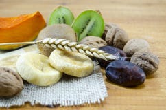 Dried Figs, Palms, Pumpkins, Wheat With Walnuts And Kiwis Royalty Free Stock Images Dried Figs, Palms, Pumpkins, Wheat With Walnuts And Kiwis Royalty Free Stock Images