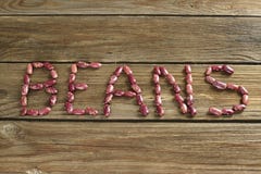 Dried red kidney beans on wooden background stock images Dried red kidney beans on wooden background stock images