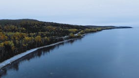 Drone flies along Lake Superior, Alona Bay, Great Lakes, Ontario, Canada