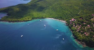 Aerial Drone view of a Tropical paradise beach surrounded by sea and jungle in the Caribbean island of St Lucia