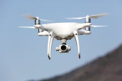 Drone flying in the sky stock photo Drone flying in the sky stock photo