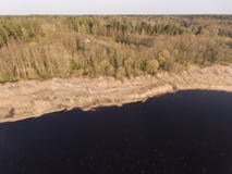 Drone photography in sunlight of sunset- beautiful coast of lake with reeds growing in water. royalty free stock photos Drone photography in sunlight of sunset- beautiful coast of lake with reeds growing in water. royalty free stock photos