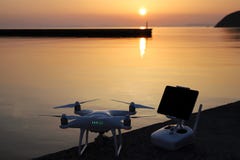 Drone and remote controller in sunset Stock Photos Drone and remote controller in sunset Stock Photos
