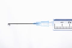 Drop Of A Liquid On A Needle Of A Syringe Royalty Free Stock Image