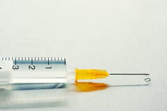Drop Of A Liquid On A Needle Of A Syringe Royalty Free Stock Image