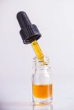 Dropper with CBD oil, cannabis live resin extraction isolated stock photos Dropper with CBD oil, cannabis live resin extraction isolated stock photos