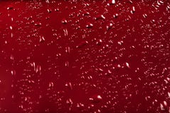 Drops of water on a red color background Royalty Free Stock Photo Drops of water on a red color background Royalty Free Stock Photo
