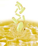 Drug yellow capsule fish oil omega3 droping in oil water. Stock Photography Drug yellow capsule fish oil omega3 droping in oil water. Stock Photography