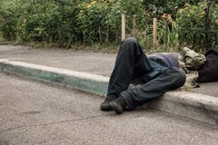 Drunk man lying on pavement. Royalty Free Stock Photos Drunk man lying on pavement. Royalty Free Stock Photos