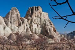 Dry branch on a garden of beautiful rocky ledges and morning blue sky stock image Dry branch on a garden of beautiful rocky ledges and morning blue sky stock image
