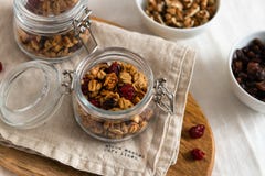 Dry breakfast cereals. Crunchy honey granola bowl with flax seeds, cranberries and coconut. Healthy, vegeterian fiber food. stock photography Dry breakfast cereals. Crunchy honey granola bowl with flax seeds, cranberries and coconut. Healthy, vegeterian fiber food. stock photography