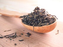 Dry fermented tea of fireweed Chamerion angustifolium also known as great willowherb or rosebay willowherb on wooden background. stock images Dry fermented tea of fireweed Chamerion angustifolium also known as great willowherb or rosebay willowherb on wooden background. stock images