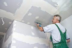 Dry Waller At Ceiling Royalty Free Stock Image Dry Waller At Ceiling Royalty Free Stock Image