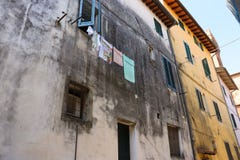 Laundry hanging on a Tuscan street stock photo Laundry hanging on a Tuscan street stock photo