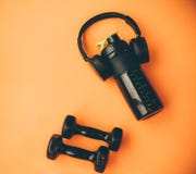 Dumbbell, headphones equipment for workout exercise stock image Dumbbell, headphones equipment for workout exercise stock image