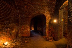 Dungeon under the old Prussian fortress illuminated by candles, Kaliningrad