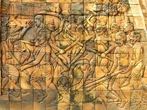 Découpage sur le mur de temple au sujet de l'histoire de guerre de combat image stock Découpage sur le mur de temple au sujet de l'histoire de guerre de combat image stock