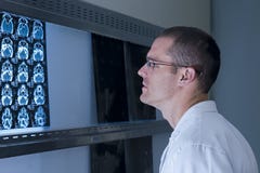 An Ear Nose and Throat Doctor viewing x-rays stock photo An Ear Nose and Throat Doctor viewing x-rays stock photo