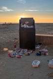An early morning photo of an over flowing rubbish bin at the sea front in Lyme Regis after a busy weekend stock images An early morning photo of an over flowing rubbish bin at the sea front in Lyme Regis after a busy weekend stock images