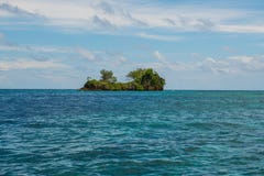 East Misool, group of small island in shallow blue lagoon water
