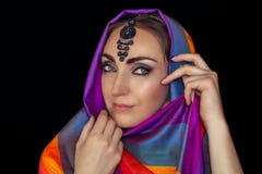 East woman in burqa with jewels on a black background. royalty free stock photography East woman in burqa with jewels on a black background. royalty free stock photography