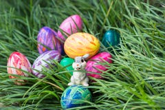Easter bunny and eggs on the green grass Stock Photo Easter bunny and eggs on the green grass Stock Photo