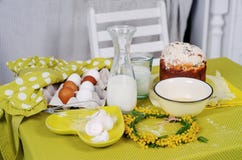 Easter cake products on the green table with flowers stock image Easter cake products on the green table with flowers stock image
