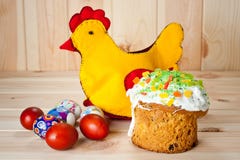 Easter cakes and painted eggs with Easter chicken on a wooden table stock images Easter cakes and painted eggs with Easter chicken on a wooden table stock images
