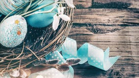 Easter. Colorful blue eggs and spring snowdrop flowers over wooden background. Easter holiday greeting card stock photos Easter. Colorful blue eggs and spring snowdrop flowers over wooden background. Easter holiday greeting card stock photos