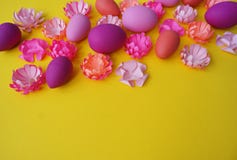 Easter eggs and flowers made of paper on a yellow background. The colors are pink, burgundy, fuchsia and yellow. Spring. Royalty Free Stock Images Easter eggs and flowers made of paper on a yellow background. The colors are pink, burgundy, fuchsia and yellow. Spring. Royalty Free Stock Images