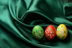 Easter Eggs On Green Satin Fabric Stock Image
