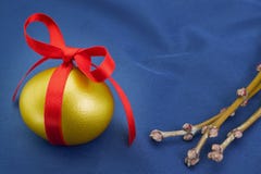 Easter golden egg with a red bow. Royalty Free Stock Images Easter golden egg with a red bow. Royalty Free Stock Images