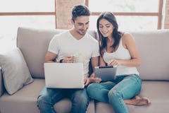 So easy! Excited beautiful happy couple is doing online shopping