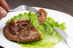 Eating Grilled Meat Steak With Salad At White Plate Stock Photo