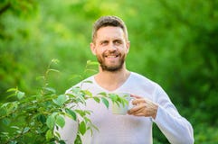 Ecological life for man. man in green forest. morning coffee. healthy lifestyle. nature and health. happy man with cup stock photo Ecological life for man. man in green forest. morning coffee. healthy lifestyle. nature and health. happy man with cup stock photo