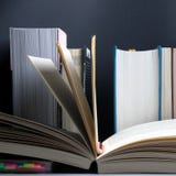 Education concept. Open book on background of bookshelf with row of important books royalty free stock image Education concept. Open book on background of bookshelf with row of important books royalty free stock image