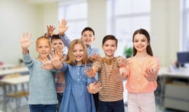 Happy students waving hands at school royalty free stock photos Happy students waving hands at school royalty free stock photos