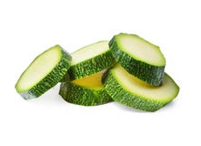 Een paar stukken van rijpe courgette op een wit isoleerden achtergrond Close-up stock fotografie Een paar stukken van rijpe courgette op een wit isoleerden achtergrond Close-up stock fotografie