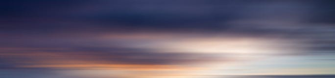 Effet coloré de tache floue de mouvement de coucher du soleil pour le fond Image stock Effet coloré de tache floue de mouvement de coucher du soleil pour le fond Image stock