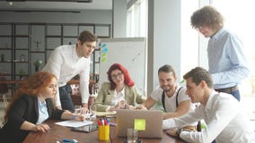 Efficient multiethnic team of young business professionals working successfully in modern office stock footage Efficient multiethnic team of young business professionals working successfully in modern office stock footage
