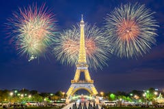 Eiffel tower light performance show and New Year 2017 fireworks in night. Stock Photo Eiffel tower light performance show and New Year 2017 fireworks in night. Stock Photo