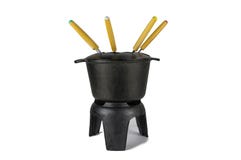 El hierro en lingotes de la 'fondue', negro, con las bifurcaciones multicoloras fotografía de archivo libre de regalías El hierro en lingotes de la 'fondue', negro, con las bifurcaciones multicoloras fotografía de archivo libre de regalías